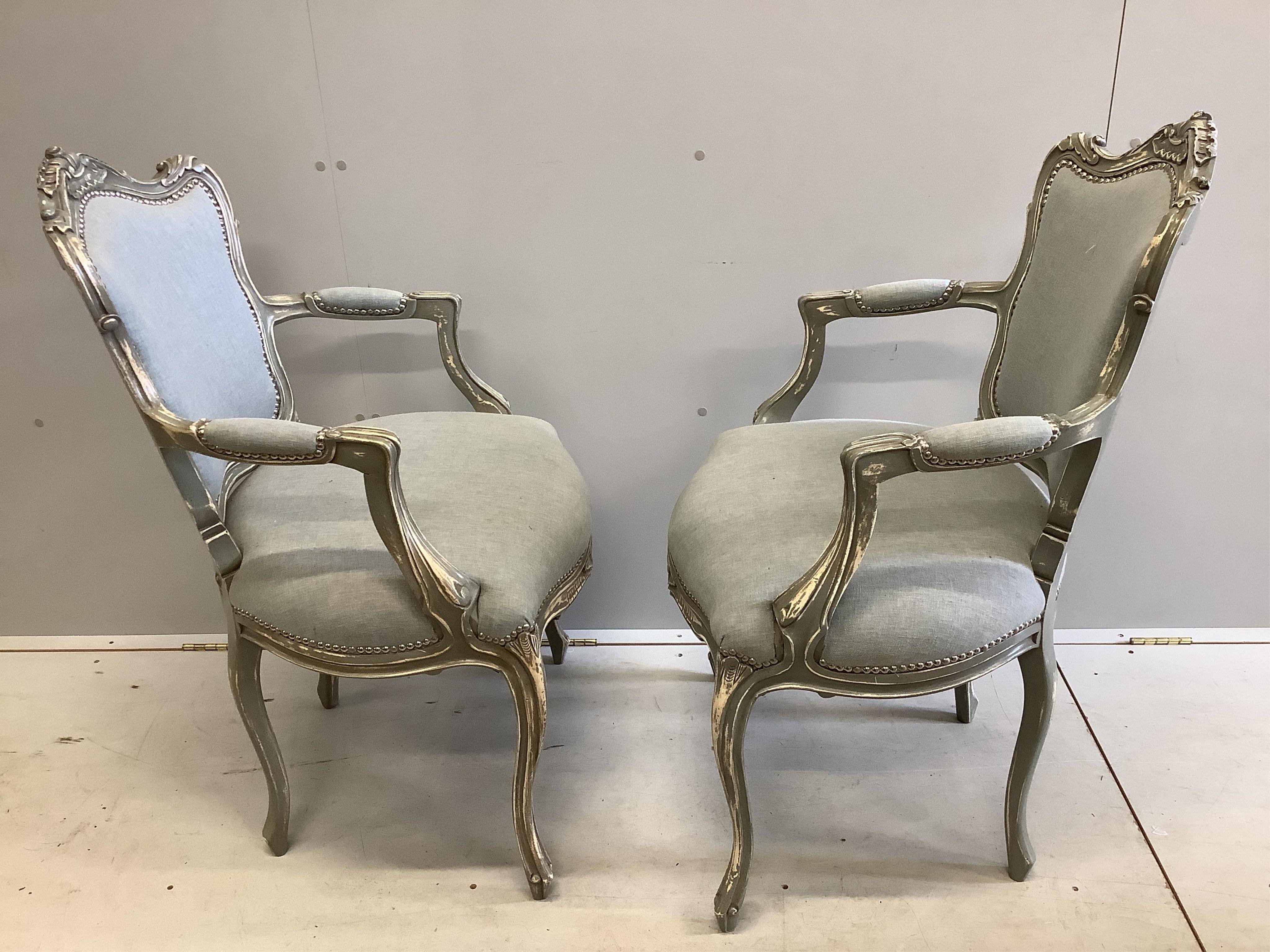 A pair of Louis XV style painted framed fauteuils, width 58cm, depth 54cm, height 99cm. Condition - good